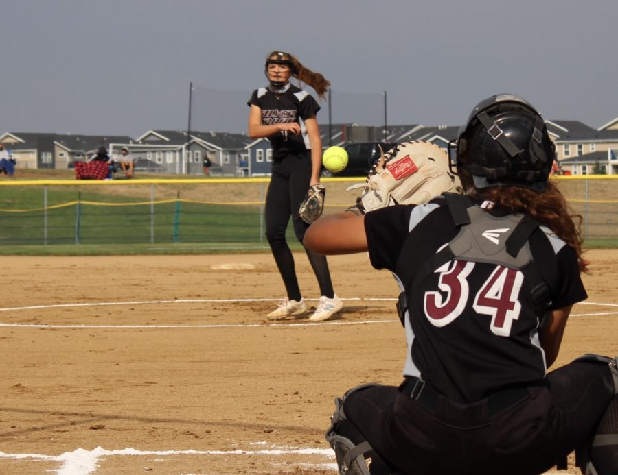 Photo+Illustration+by+Madelyn+Bowling-Garcia%0AMaddie+Kuehl%2C+Silver+Creek%E2%80%99s+Varsity+Softball+pitcher+warming+up+with+Varsity+catcher%2C+Ashley+Gaccetta.+%0ATaking+the+field%2C+Silver+Creek%E2%80%99s+Varsity+Softball+team+warmed+up+for+their+game+against+the+in-town+competitors%2C+Skyline+High+School.+In+the+circle%2C+Maddie+Kuehl+%2812%29+pitched+to+Ashley+Gaccetta+%2811%29.+To+start+off+the+game%2C+Silver+Creek+showed+out+on+their+home+turf%2C+with+three+consecutive+strikeouts.+Not+pictured%2C+the+infielders+gathered+around+their+pitcher+after+each+successful+strikeout.+%E2%80%9CWhen+my+infielders+gather+around+me+after+a+strikeout%2C+it+gets+me+hyped+to+get+the+next+out+for+my+team%E2%80%9D+said+Maddie+Kuehl.%0A