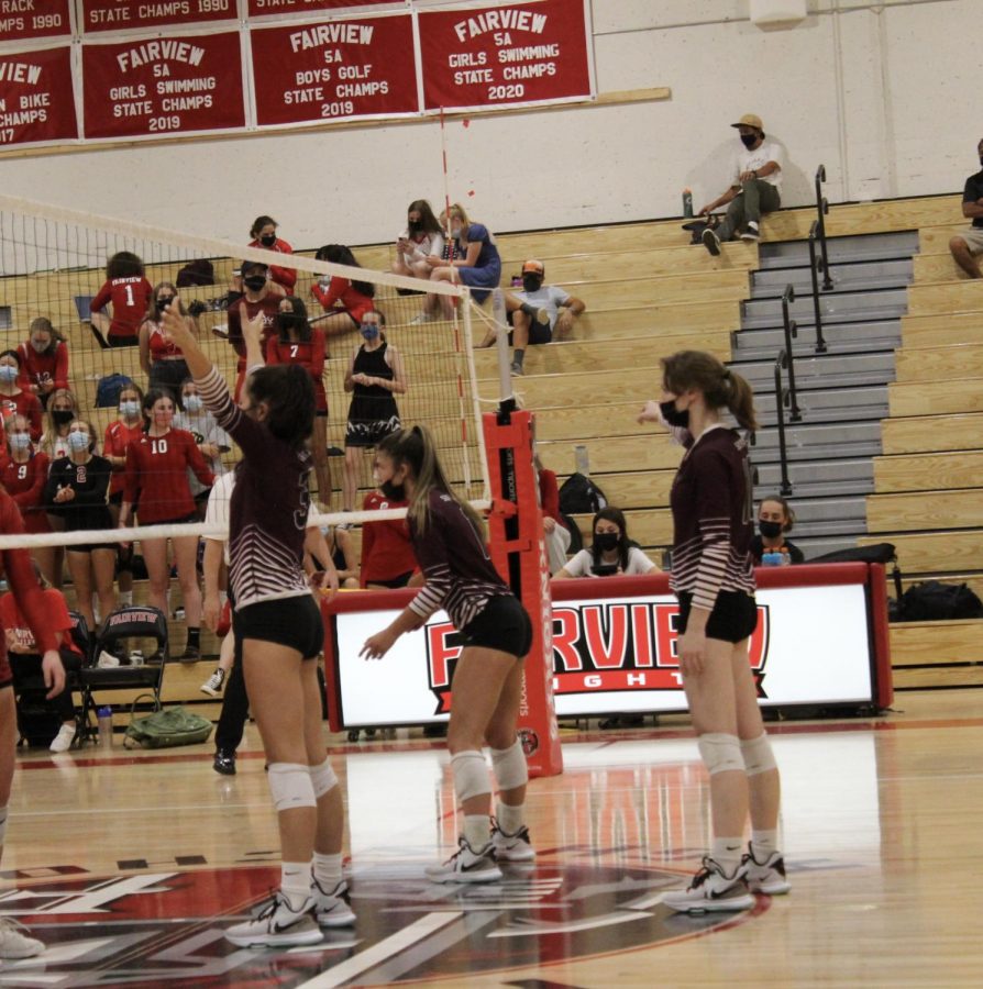 Ready to defend the net, seniors Stella Starck (middle blocker), Hannah Williamson (setter), and Megan Sotiroff (outside hitter) prepare to start off the first set of their match against Fairview High School. On August 19th, 2021 the Silver Creek Raptors went up against the Fairview Knights in the season opener for both teams. The schools fought back and forth all night, in a nail-bitter five-set match. The knights took the first, third, and fifth set to ultimately win the match.