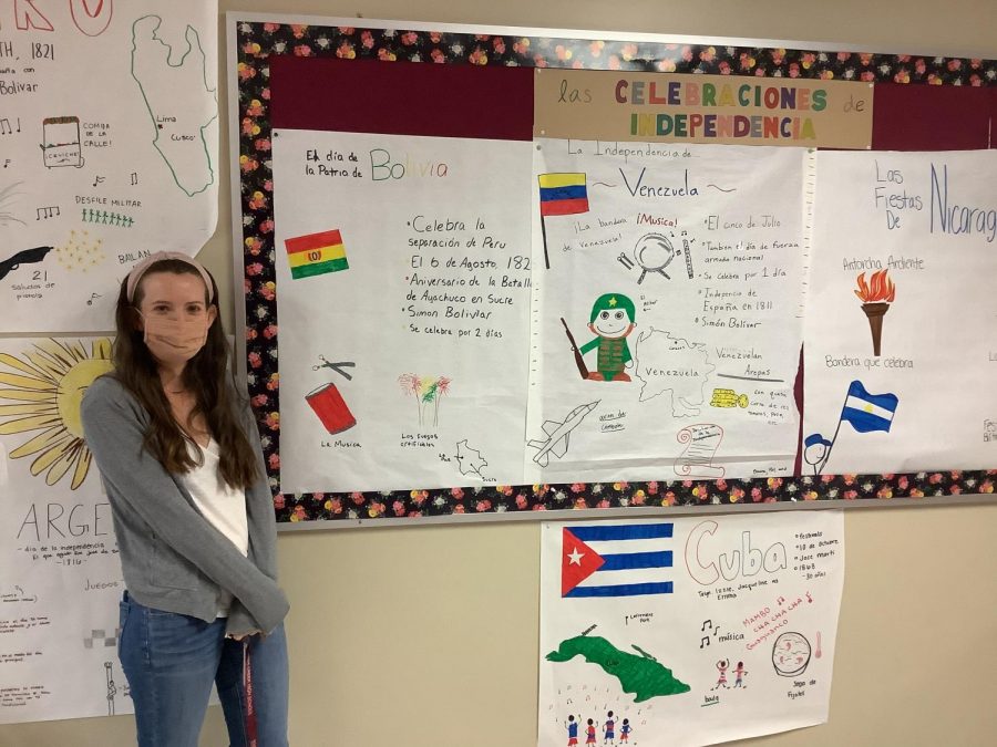Mrs. Neil, a Spanish teacher at Silver Creek High School, stands in front of the independence posters her and her students made for Hispanic Heritage Month, on October 8th, 2021.
