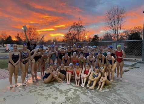 The Silver Creek Girls Swim and Dive Team poses in front of a beautiful Colorado Sunset after a practice at the Ed & Ruth Lehman YMCA pool. The girls had their first meet December 2 and won, starting off the season with a 1-0 record.