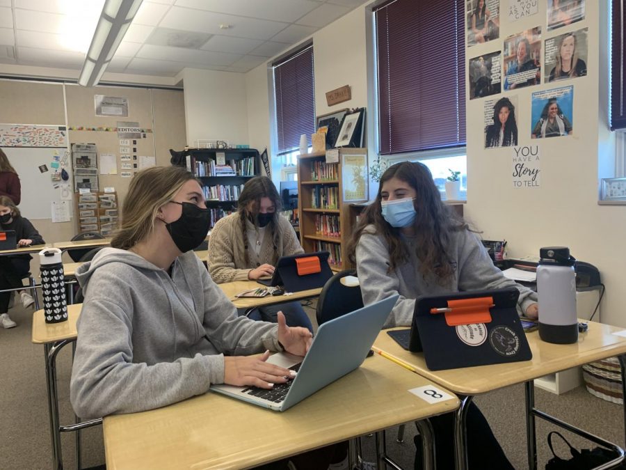 Sharing a Laugh, students Mackenzie Larson, Hannah Deibert, and Ashley Gaccetta are socializing and getting work done during fully in-person learning.