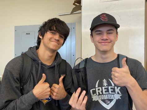 Excited to not be wearing masks, Aris Lindquist and Connor Lopez pose for a picture. The two students at Silver Creek High school are happy to finally be done with the mask mandate. With the dropped mask mandate, they can show off their faces and smiles.