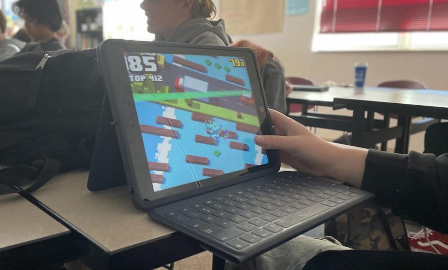 During+work+time+in+class%2C+a+student+plays+a+game+on+their+iPad+instead+of+doing+their+work.+This+is+one+reason+why+the+school+has+had+to+reinforce+rules.