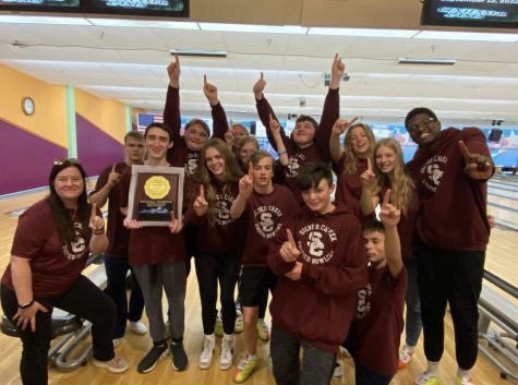 The unified bowling team celebrate their hard earned victory at regionals and hold up their trophy!