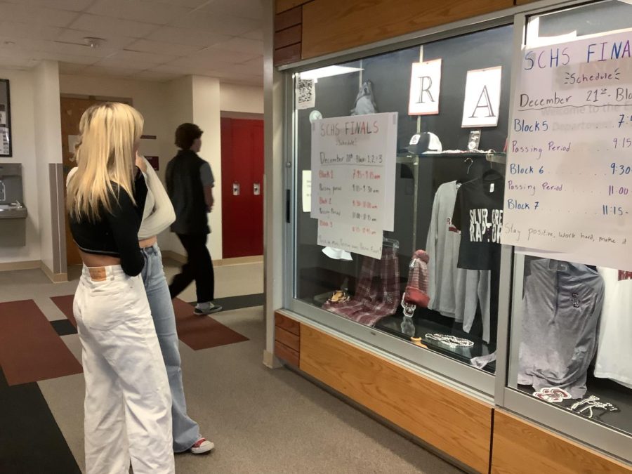 Students Paige Numedahl and Carlynn Foley are looking at posters to get prepared for finals week.