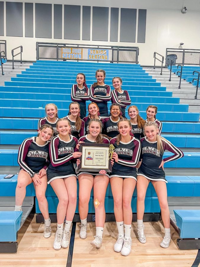 The Silver Creek Varsity Cheer Team celebrates their big win together at the League Competition.