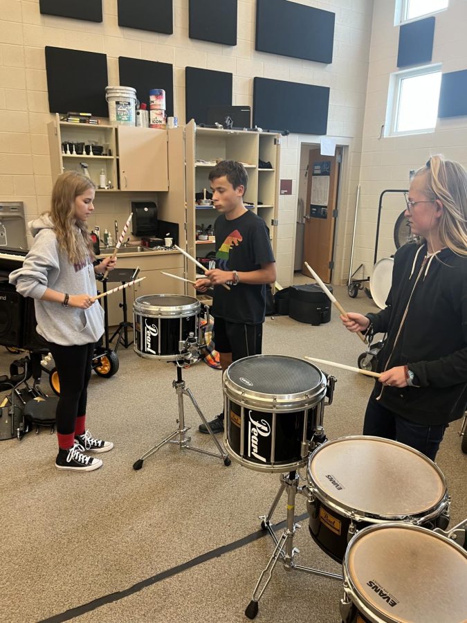 Mentor Serenity Sisneros rehearses with students Nikolai Nelson and Hope Palmquist.