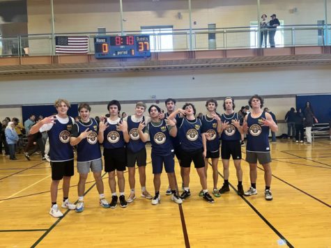 Longmont Bears in the Longmont Rec Center hold up W’s on their hands. After a shutout win during the 2nd to last game of the season, the team celebrated the win.