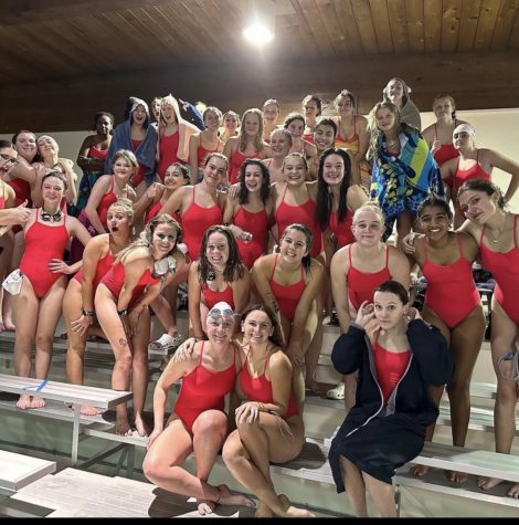 The Silver Creek girls swim team poses, at Brighton, on December 1. The swim team girls gather around for a picture at their meet against Brighton.