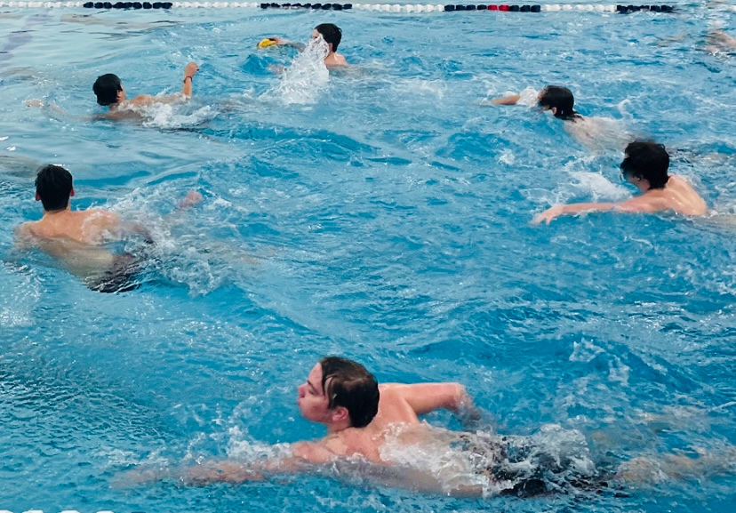 On+the+morning+of+Feb.+25%2C+2023%2C+Neil+Marble+and+his+fellow+swim+mates+were+playing+water+polo+as+they+got+ready+for+the+swim+practices.+They+will+be+following+this+routine+of+going+to+the+Aquatic+center+and+getting+ready+for+state+with+their+coaches+Debora+Stewart+and+Anthony+Huff+guiding+them.+%E2%80%9CWe+are+looking+pretty+good+and+strong+this+year%2C%E2%80%9D+Stewart+said.