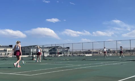 Silver Creek Girls tennis team practicing right before their match against Fruita Monument.
