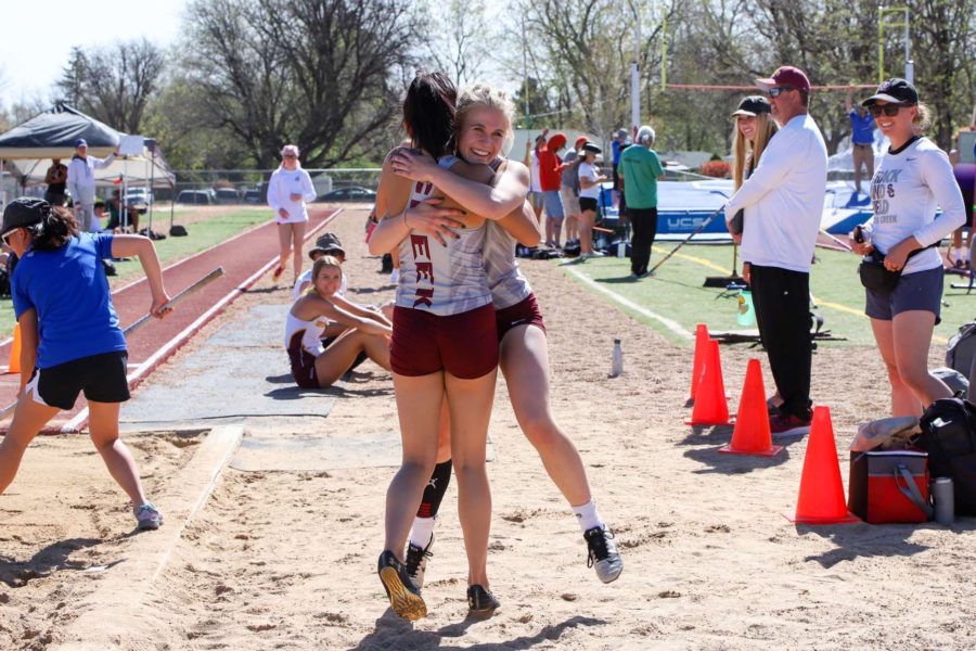 Katie+Bogdanova+embraces+her+teammate+after+competing+in+the+long+jump.