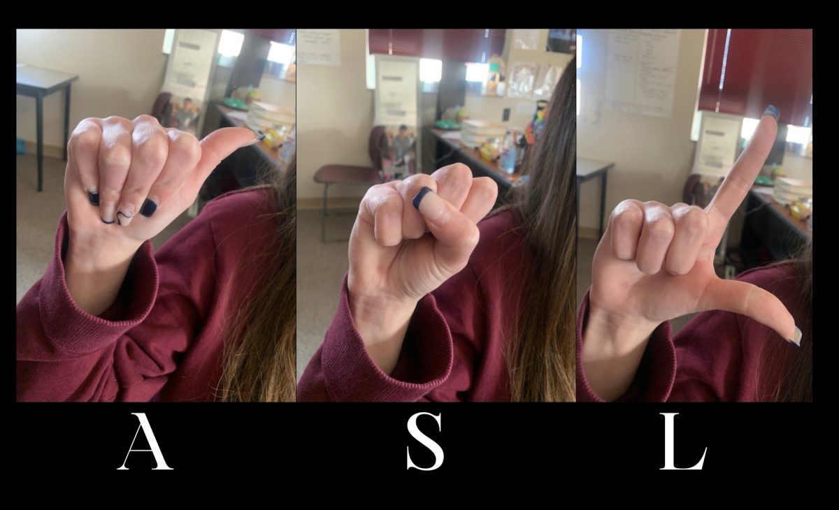 Maddie Sales fingerspelling ‘ASL’.