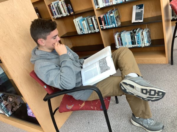 Drew Heath, a student of Silver Creek High reading through an assigned English book.