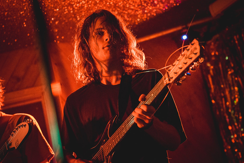 King Gizzard and the Lizard Wizard at the Moth Club. Photo courtesy of Paul Hudson Public Domain. Pictured is Stu Mackenzie