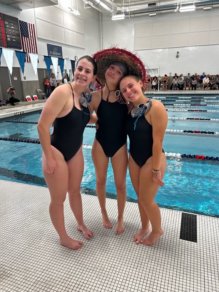 Girls Silver Creek Swim Team members (left to right) Lucia de La Lama, Isabelle Casas, and Anna Longenecker getting ready for state by participating in some silly practices.