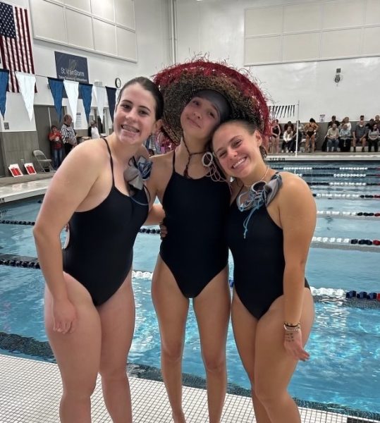 Silver Creeks Girls Swim Team members (left to right) Lucia de La Lama, Isabelle Casas, and Anna Longenecker getting prepared for state by participating in some silly practices!