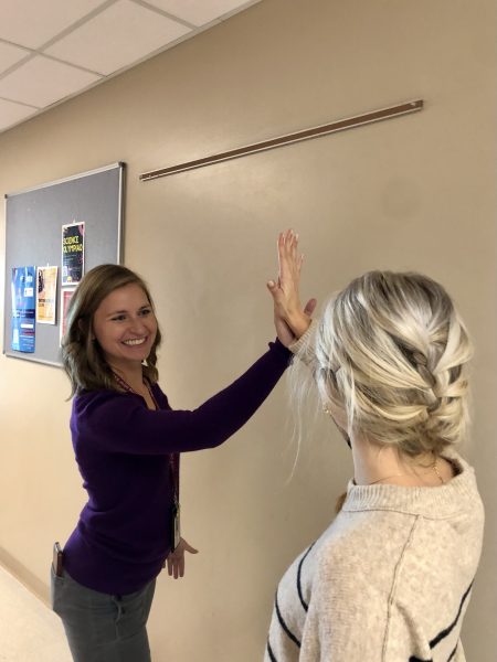 Silver Creek High School science teacher Rachel Turner gives senior Jordan Randal a high five in between classes. Showing support for one another is important, especially during bullying awarness and prevention month. 