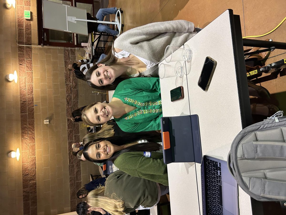 SCLA students Diamari Flores (left) and Lucia de La Lama (right) meet with their mentor, Rachel Turner (middle), on November 14th at the family-mentor dinner.