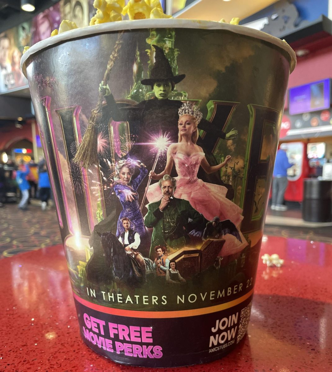 The medium popcorn at the AMC movie theater in Broomfield, Colorado, featuring some characters from wicked. 