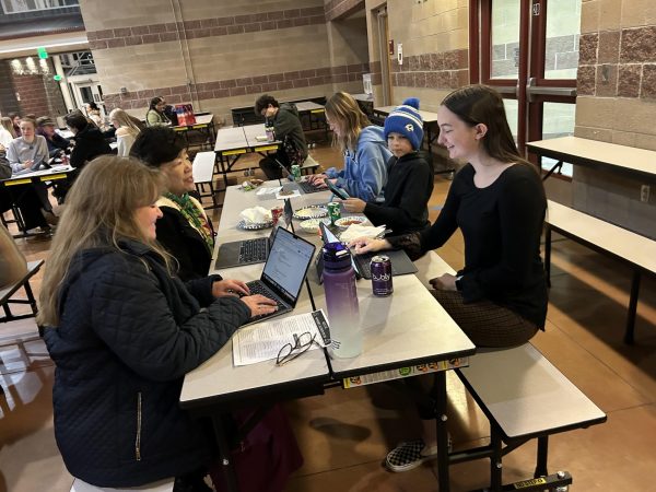 Brooklyn Goldstone and her mentors Tina Fredo and Kristin Holtz hard at work during the SCLA Capstone Mentor work dinner.