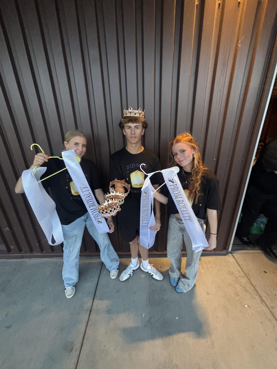 From left to right Kora Ballingham, Brody Simpson, and Lucy Barbour members of the SCLA 10 prom planning committees getting ready to crown and sash the prom court winners.