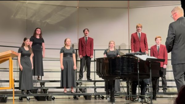 Silver Creek choral students and their director perform a piece at the October 7th, 2025 fall concert. From left: Coral Buchalter, Hailey Donahue, Sam Haddon, Travis Weaver, Claire Gaddis, Desmond Baker, Logan Case and Jeremy Skelton.