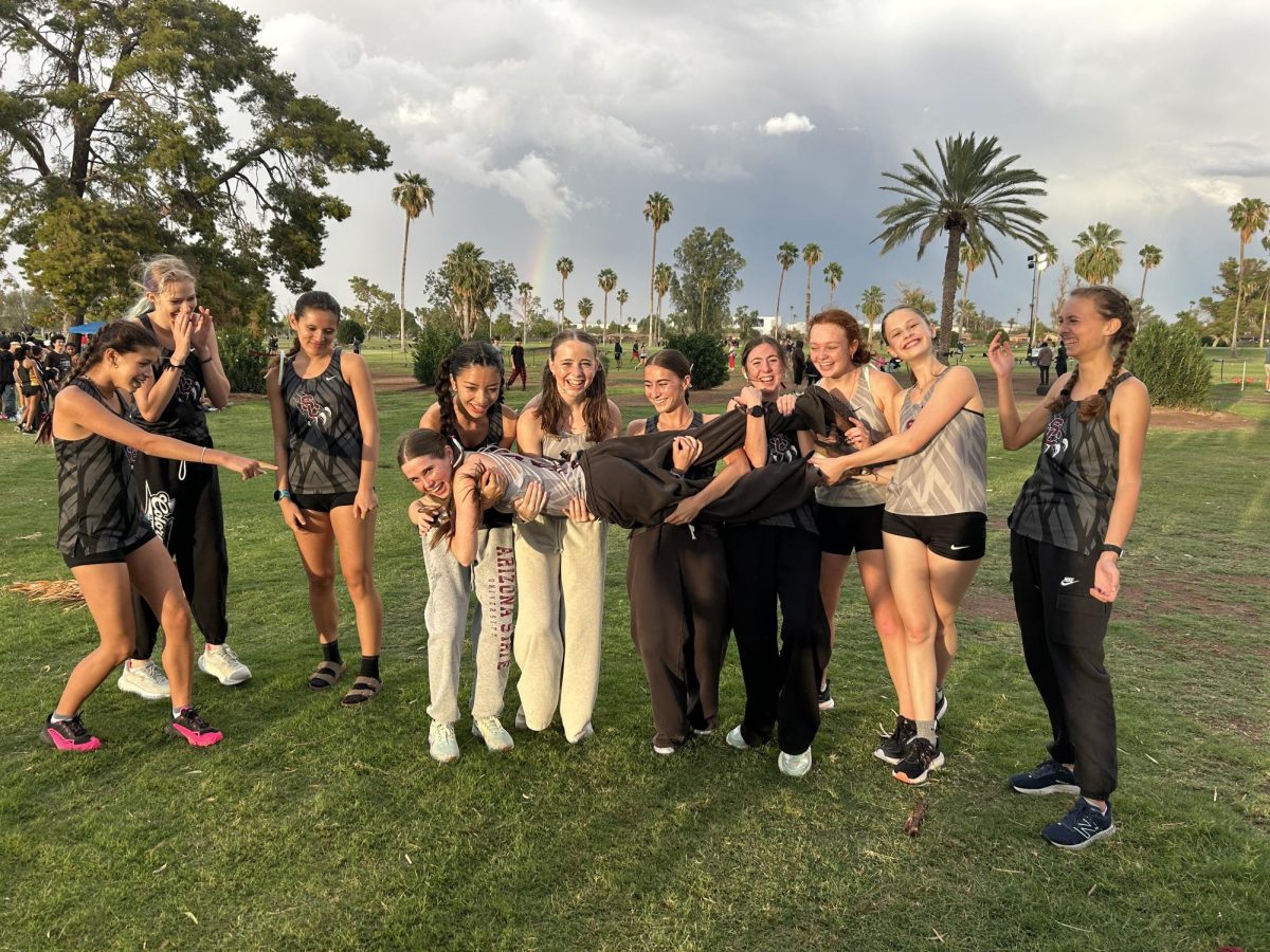 The girls cross country team in Mesa, Arizona attending the Nike Desert Twilight meet. 
From Left: Mica Friedly (11), Emerson Laughlin (11), Brooke Colvin (12), Zeva Robinson (11), Maya Goodman (10), McKenzie Palles (11), Makenzie Livingston (11), Mia Kunio (10), Daphne Moe (10), Elise Nerlich (11), Megan Bader (11)