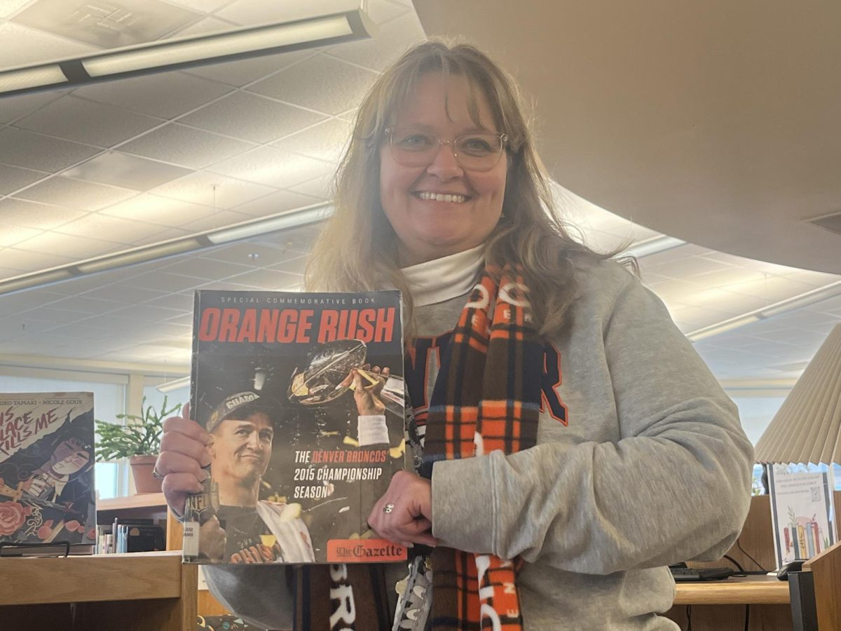 Silver Creek High School librarian Kirstin Holtz wearing her Broncos gear