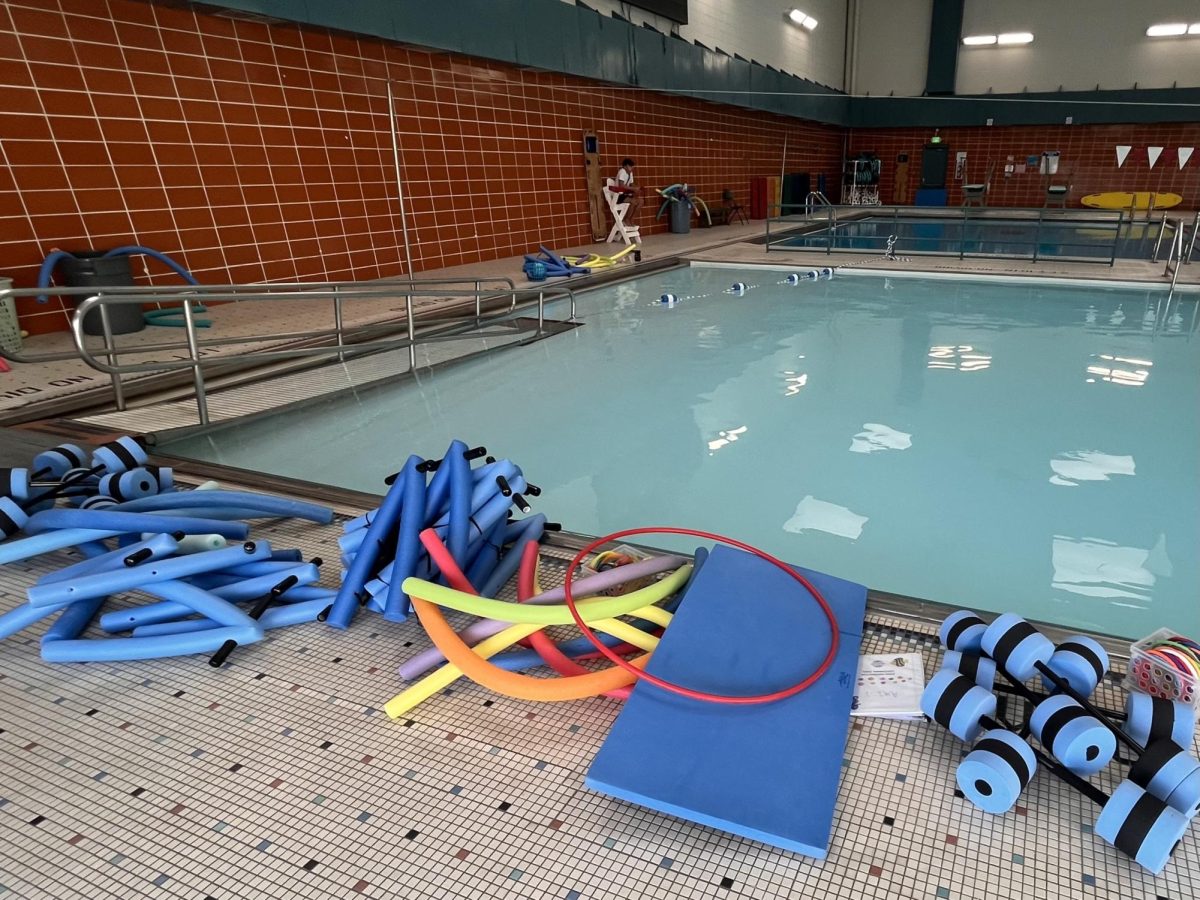 Before swim lessons begin, Swim Instructors lay out their materials at Centennial Pool, March 4th.