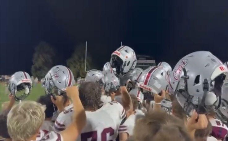 Silver Creek celebrates a 27-14 victory over Rival Longmont at Longmont High School in the fall of 2025. They hold their Riddell helmets up to celebrate the win, with next year’s helmets being new and improved.