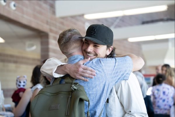 Andre Apodaca and another 2012 football inductee embraced each other during the Hall of Fame event on May 2nd. The event allowed for athletes to reconnect and share memories of their high school experience.