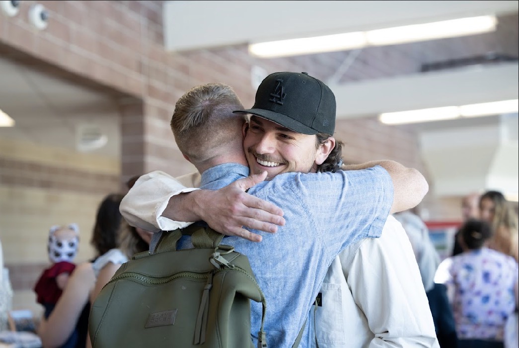 Andre Apodaca and another 2012 football inductee embraced each other during the Hall of Fame event on May 2nd. The event allowed for athletes to reconnect and share memories of their high school experience.